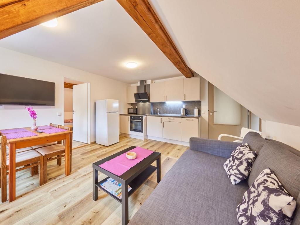 a living room with a couch and a table at Apartment Stela by Interhome in Bolkov