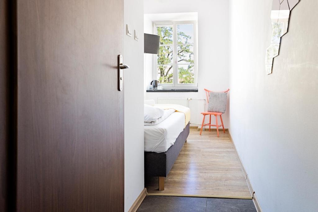 Posteľ alebo postele v izbe v ubytovaní Folk Hostel