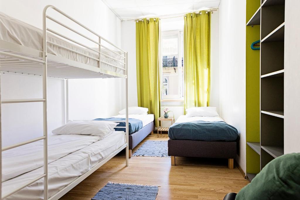 Posteľ alebo postele v izbe v ubytovaní Folk Hostel