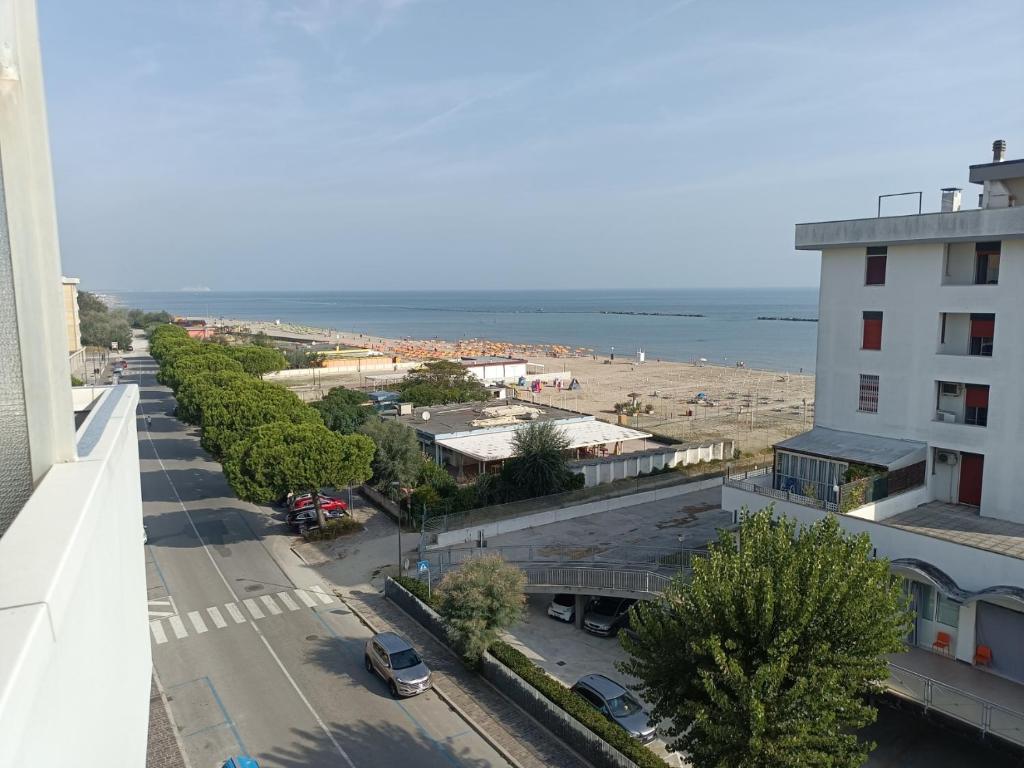 a view of a street and a beach from a building at CASA ADRIANO frontemare WIFI e NETFLIX in Lido Adriano