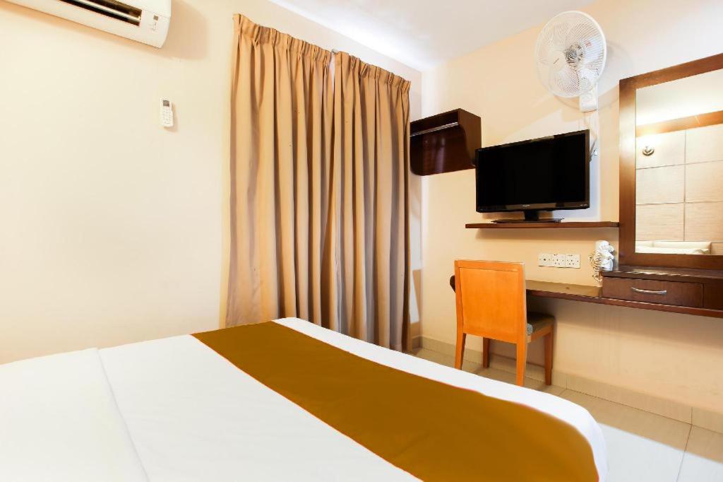Postel nebo postele na pokoji v ubytování Sejati Hotel