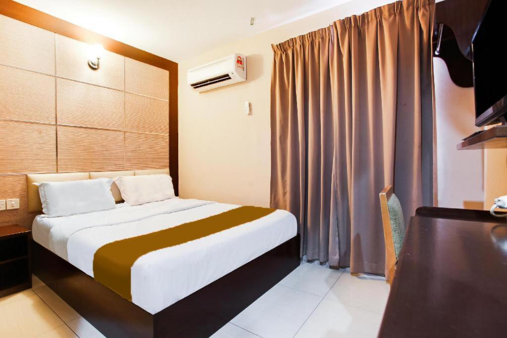 Postel nebo postele na pokoji v ubytování Sejati Hotel