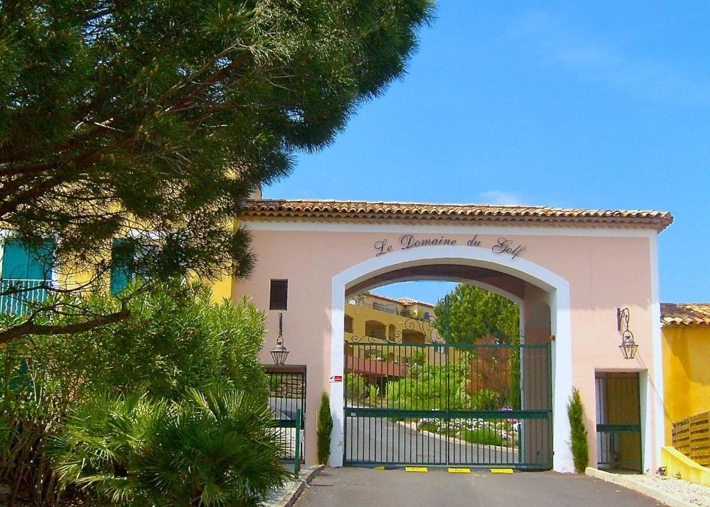 a building with a gate in front of it at Studio Apartment - Domaine du Golf Resort in Roquebrune-sur-Argens