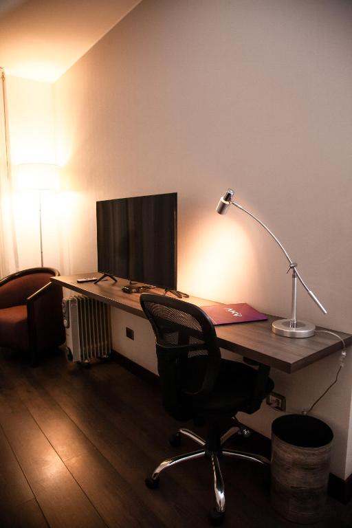 TV a/nebo společenská místnost v ubytování Aku Hotels