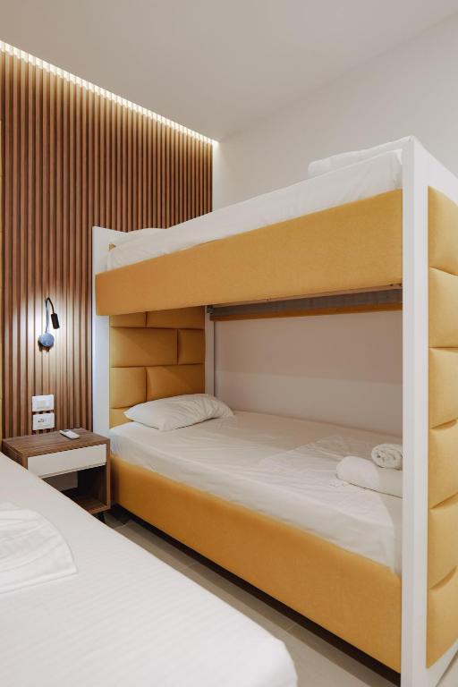 a bedroom with two bunk beds next to each other at Vila Shpetimi in Ksamil