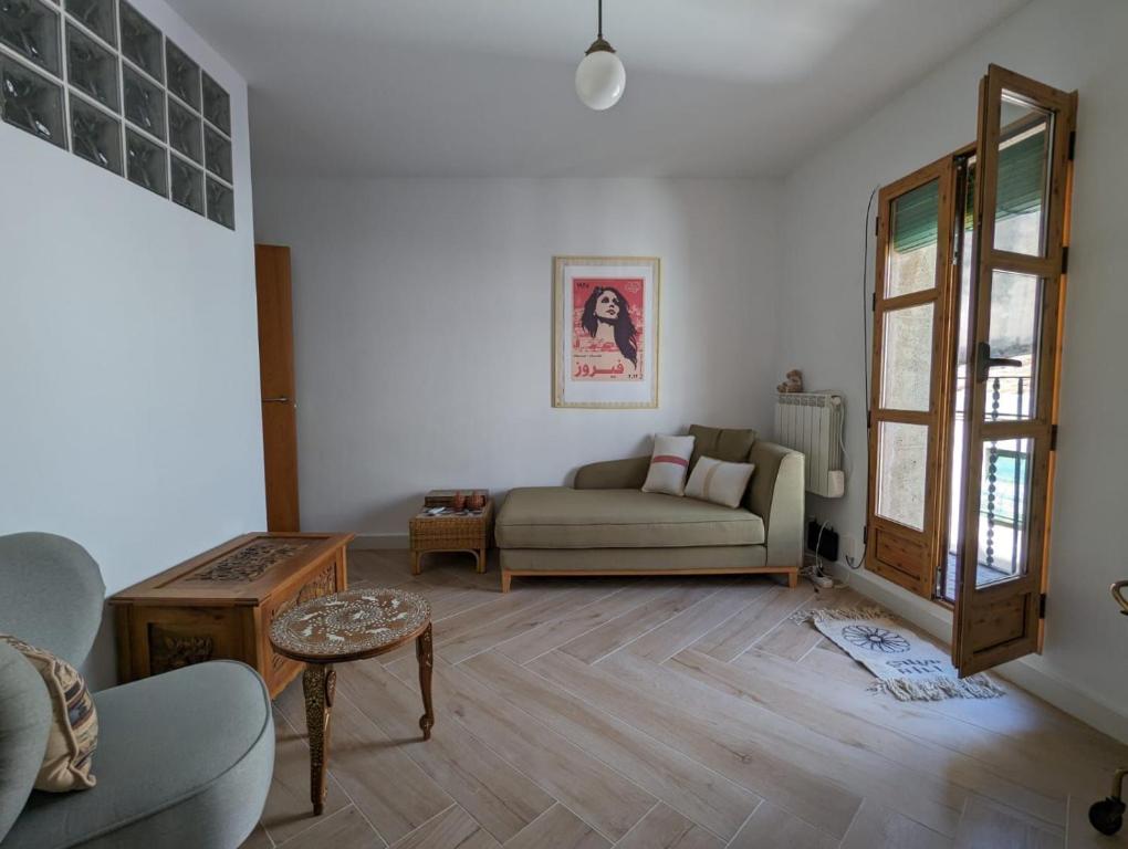 a living room with a couch and a table at La Paloma in Tarragona