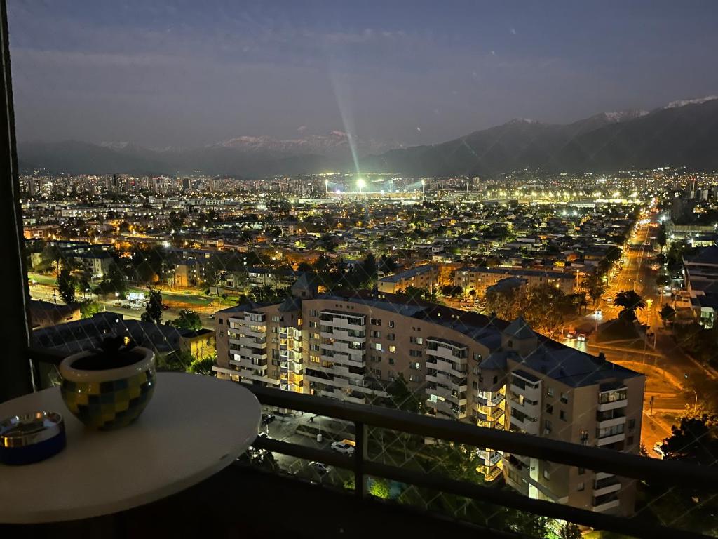 a view of a city at night from a balcony at Amazing view of Santiago in Santiago