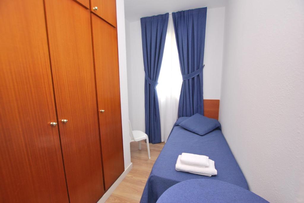 Posteľ alebo postele v izbe v ubytovaní Hotel Tres Leones