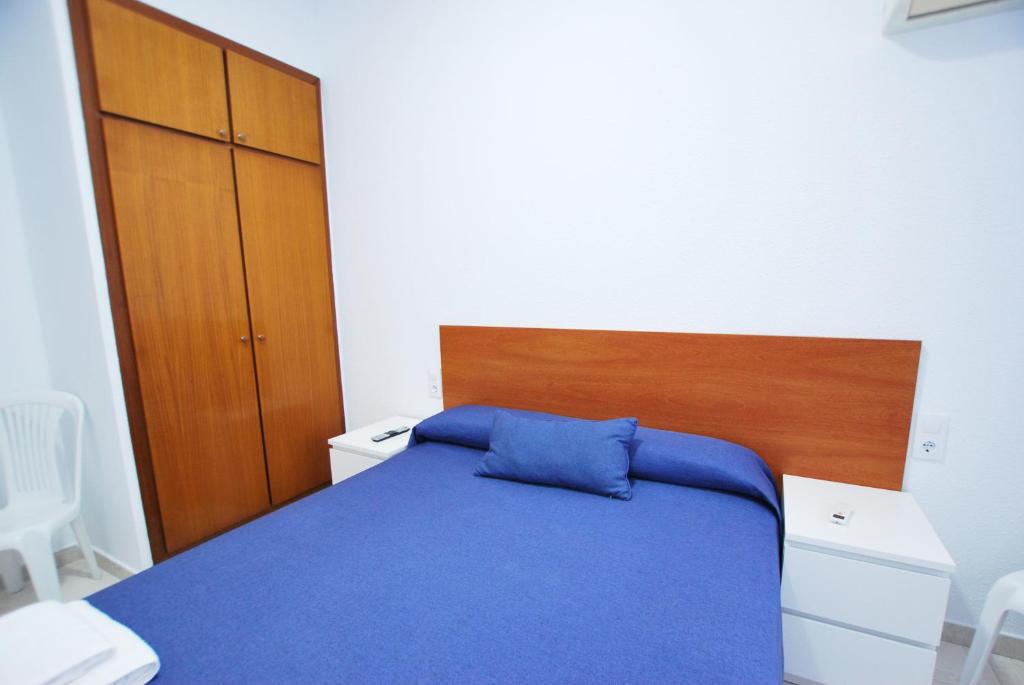 Posteľ alebo postele v izbe v ubytovaní Hotel Tres Leones