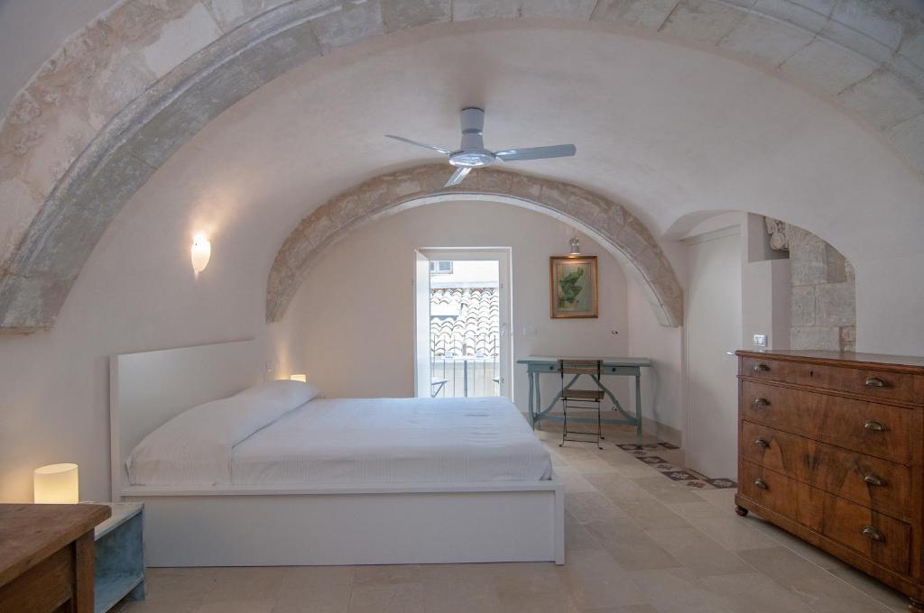 Posteľ alebo postele v izbe v ubytovaní Palazzo Degli Olivi