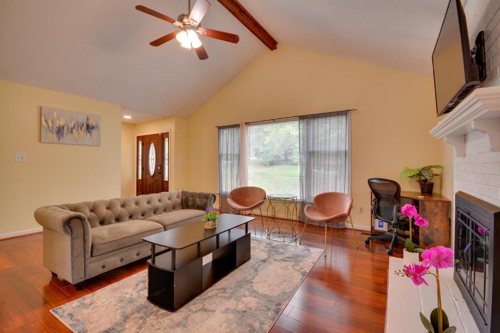 a living room with a couch and a fireplace at Pet Friendly Charming Cozy Greensboro Gem! in Greensboro