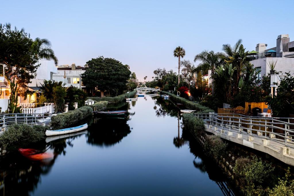 a river with boats on it in a city at Venice on the Beach Hotel in Los Angeles