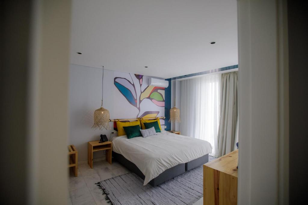 Postel nebo postele na pokoji v ubytování Cowork Lab Suites
