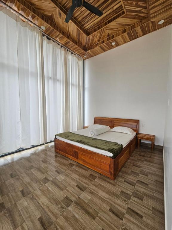 Tempat tidur dalam kamar di Thác Mây Garden
