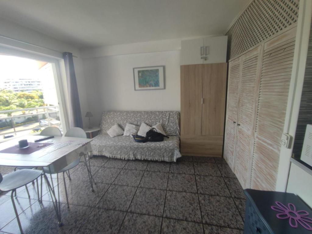 a living room with a couch and a table at La Siesta Apt in Salou