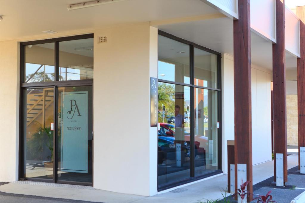 a store front with glass windows on a building at Park Avenue Hotel Motel in Rockhampton