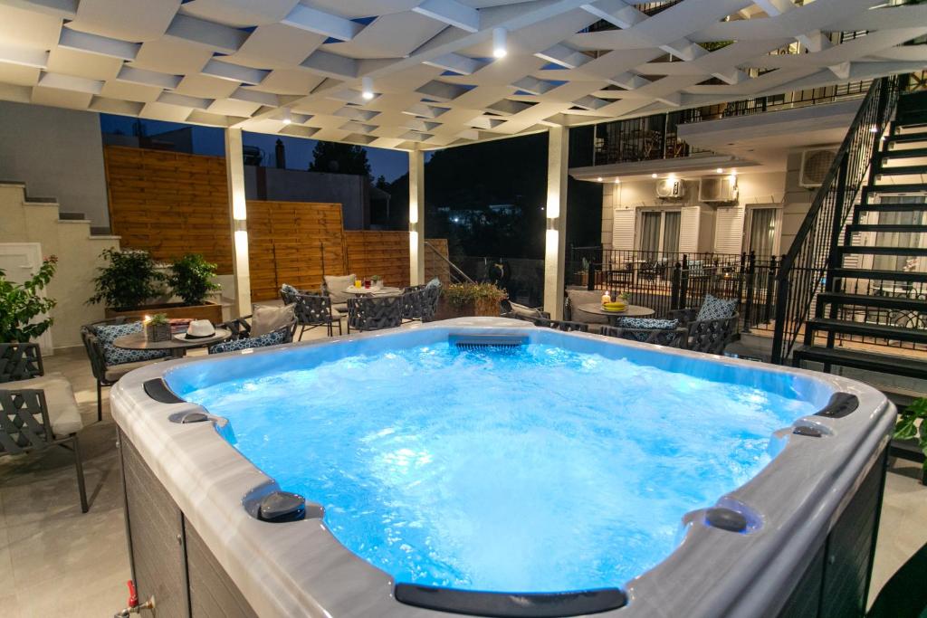 a large hot tub on a building with a patio at Pargas Dream in Parga