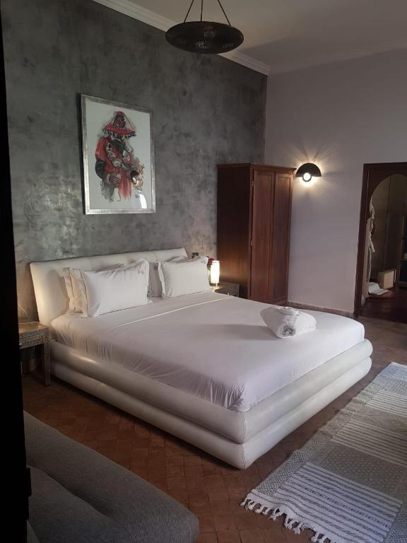 Postel nebo postele na pokoji v ubytování Riad les Ammonites and Spa