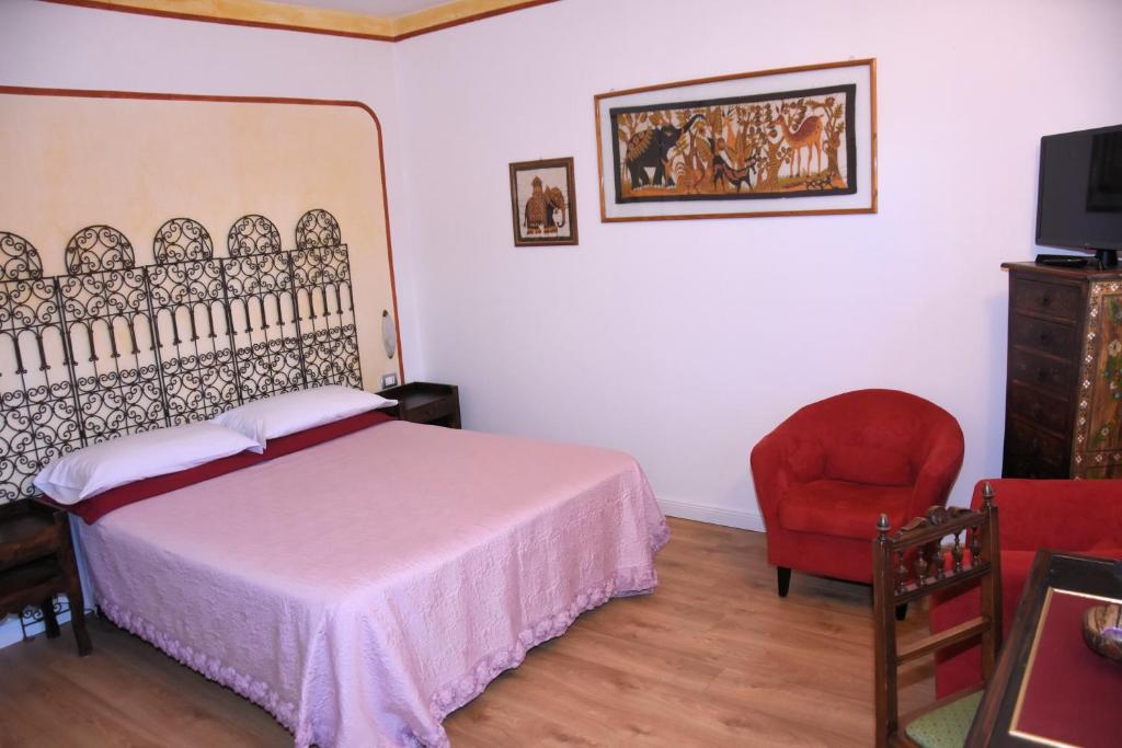 Postel nebo postele na pokoji v ubytování Guest House La Carolina