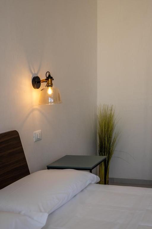 Voodi või voodid majutusasutuse Murieri Rooms toas