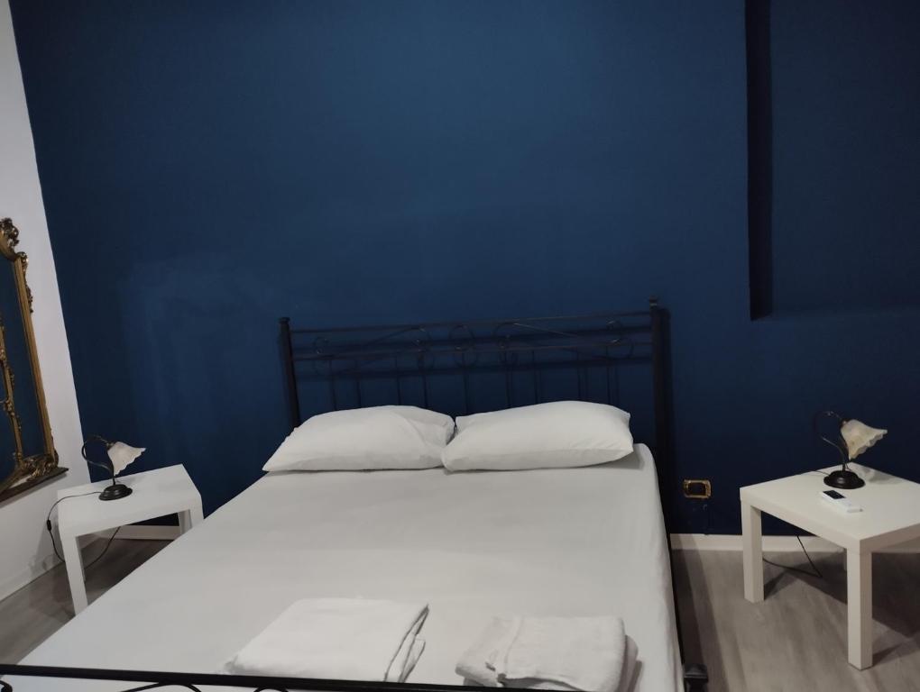 Un pat sau paturi într-o cameră la casa Giuseppe