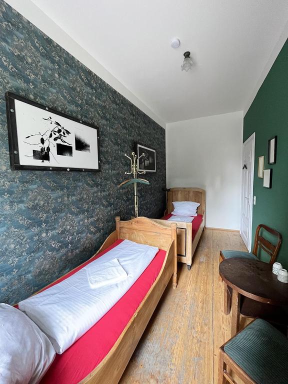 Postel nebo postele na pokoji v ubytování Homeplanet Hostel