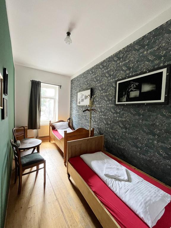Postel nebo postele na pokoji v ubytování Homeplanet Hostel