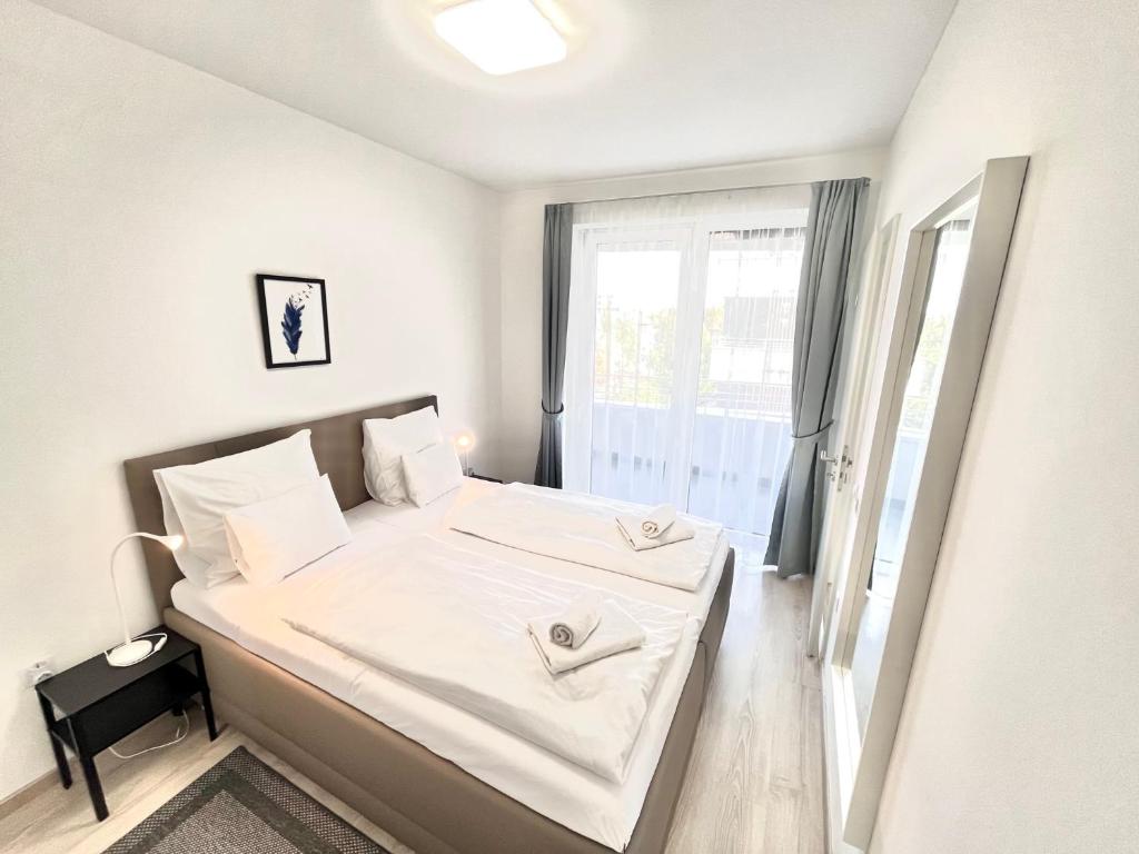 Posteľ alebo postele v izbe v ubytovaní BUDAPEST DOWNTOWN RESIDENCES LEO - AC, ELEVATOR, TERRACE
