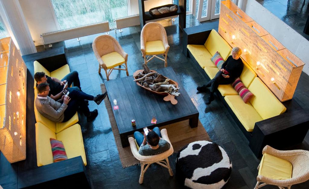an overhead view of a group of people sitting around a table at Remota Patagonia Lodge in Puerto Natales