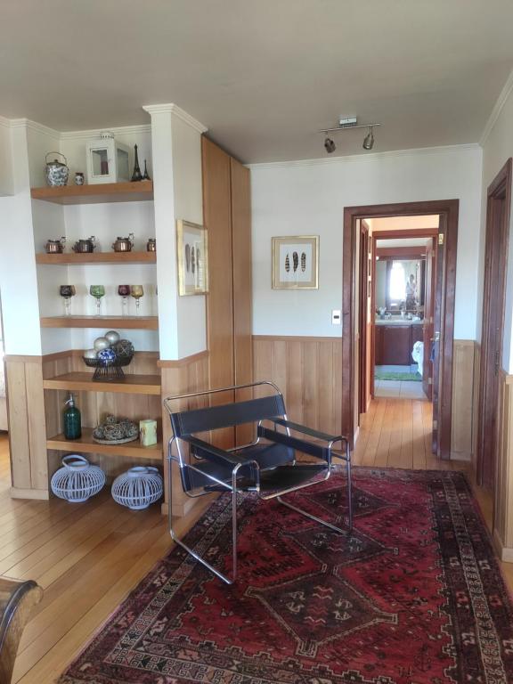 Posezení v ubytování Casa Mia, Puerto Varas, habitación doble
