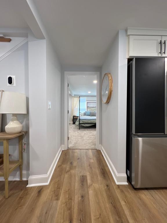 a kitchen with a refrigerator and a living room at 5BR 4B Huge Space with 2 Level Game Barn in Greenville