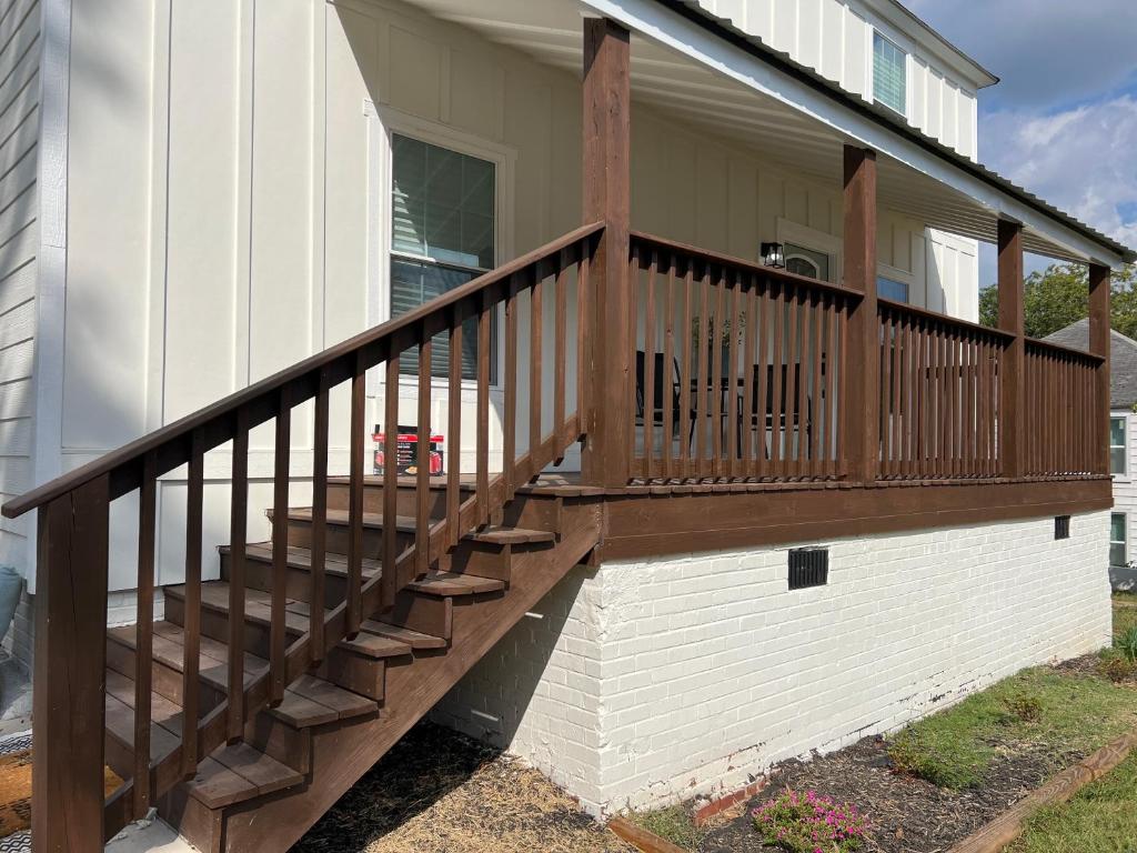 a wooden deck on the side of a house at 5BR 4B Huge Space with 2 Level Game Barn in Greenville