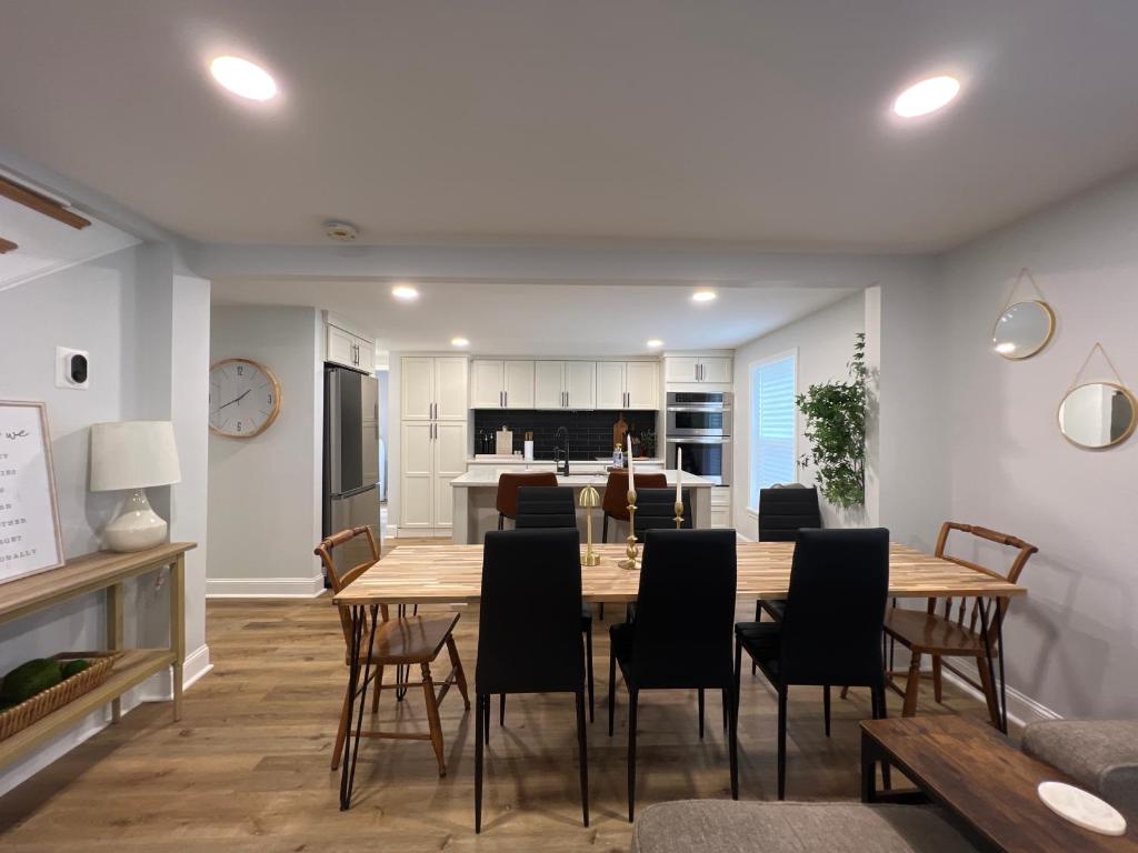 a kitchen and dining room with a table and chairs at 5BR 4B Huge Space with 2 Level Game Barn in Greenville