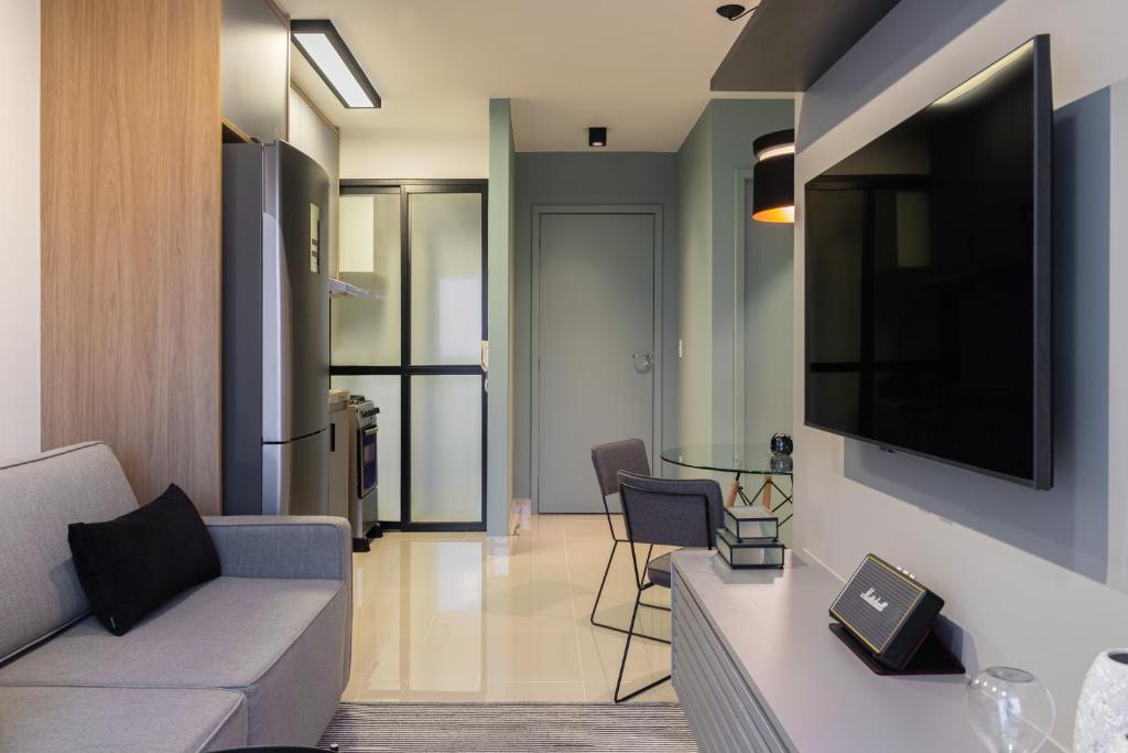 Istumisnurk majutusasutuses Apartamento moderno, com home office e garagem.