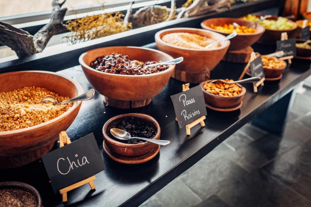 a display of different types of food on a counter at Remota Patagonia Lodge in Puerto Natales