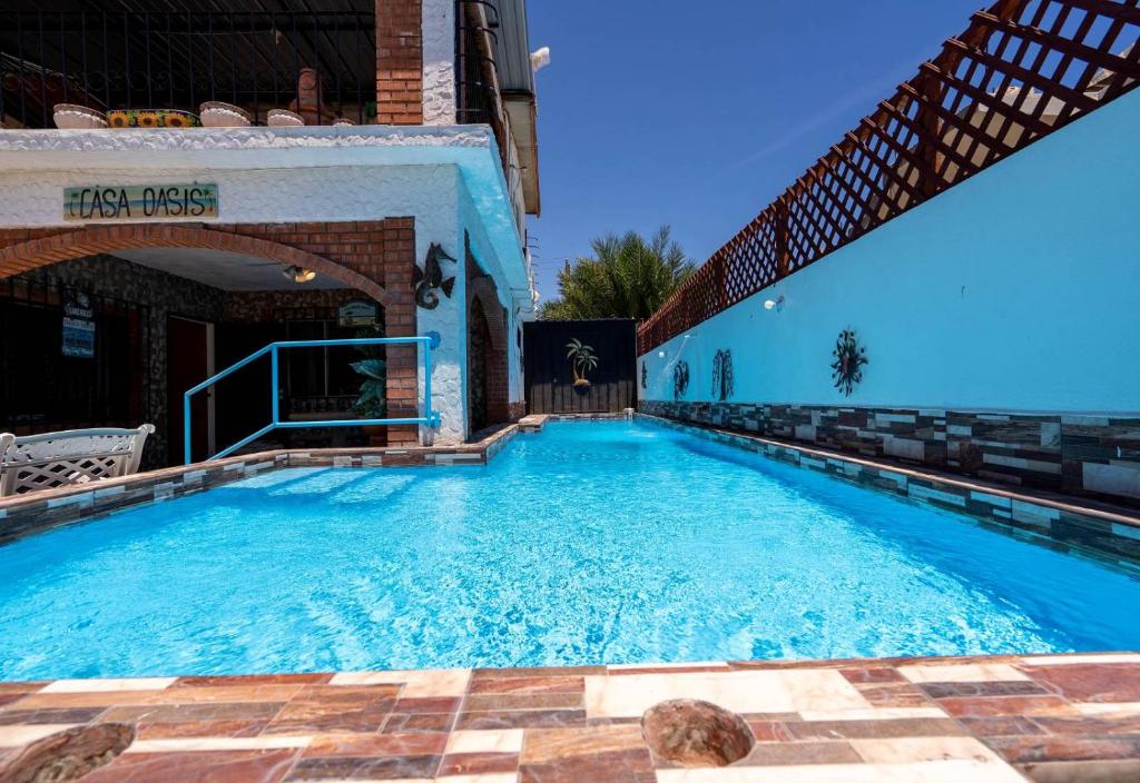 a large swimming pool with blue water at Huge Family - 5 bedroom sleeps 16 with private pool home in San Felipe