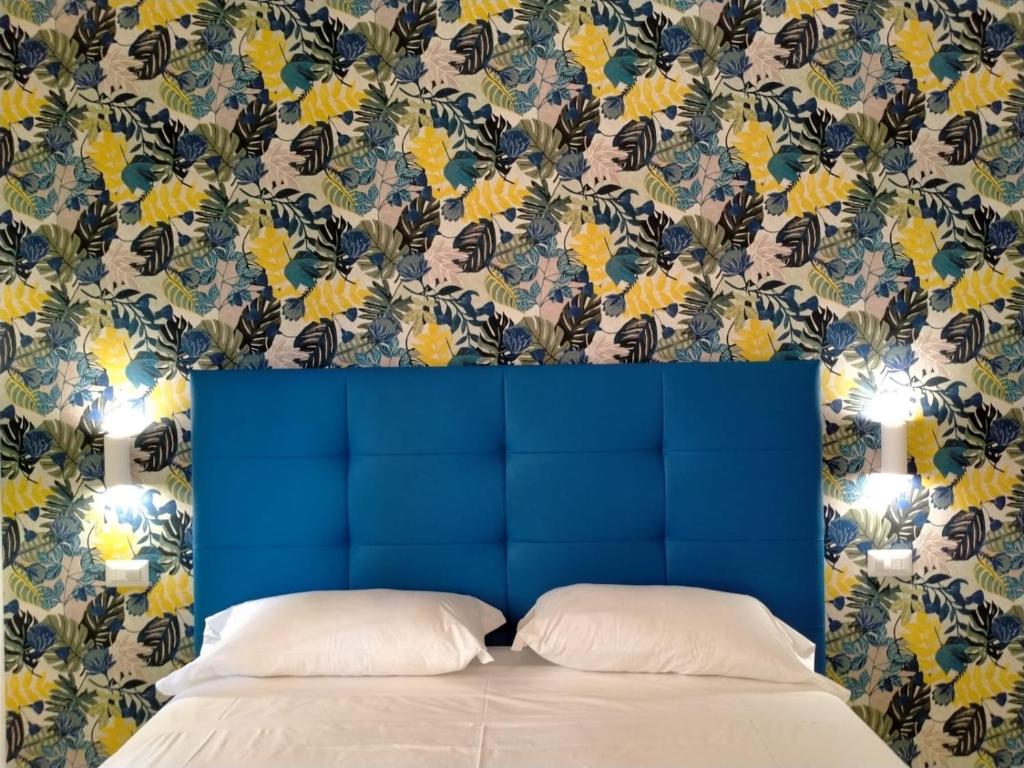 Ένα ή περισσότερα κρεβάτια σε δωμάτιο στο Casa Bocciolino