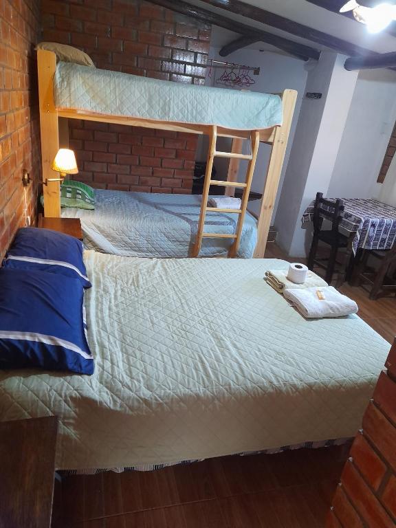 Postel nebo postele na pokoji v ubytování Casa Hospedaje"Los Capulies"