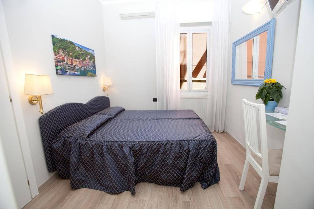Postel nebo postele na pokoji v ubytování Hotel Il Gatto