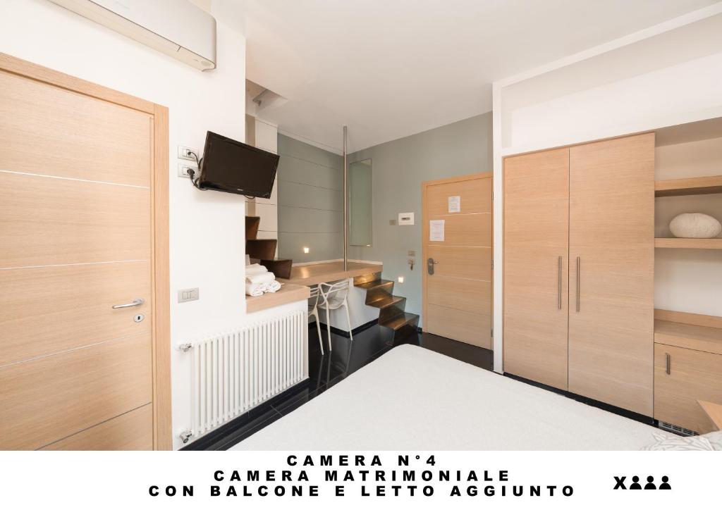 TV a/nebo společenská místnost v ubytování Affittacamere Lo Scoglio (Guesthouse)
