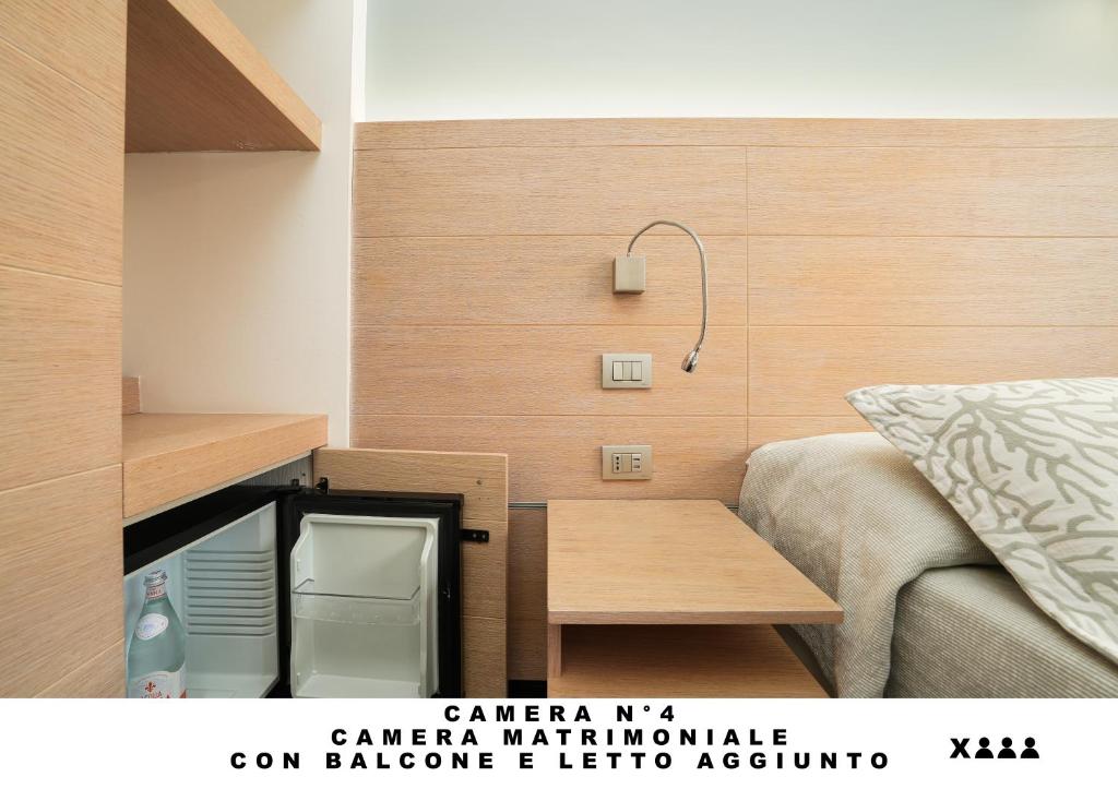 Postel nebo postele na pokoji v ubytování Affittacamere Lo Scoglio (Guesthouse)
