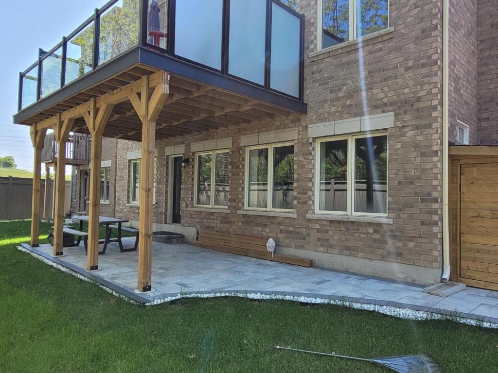 a house with a deck and a patio at Jackzhang in Aurora