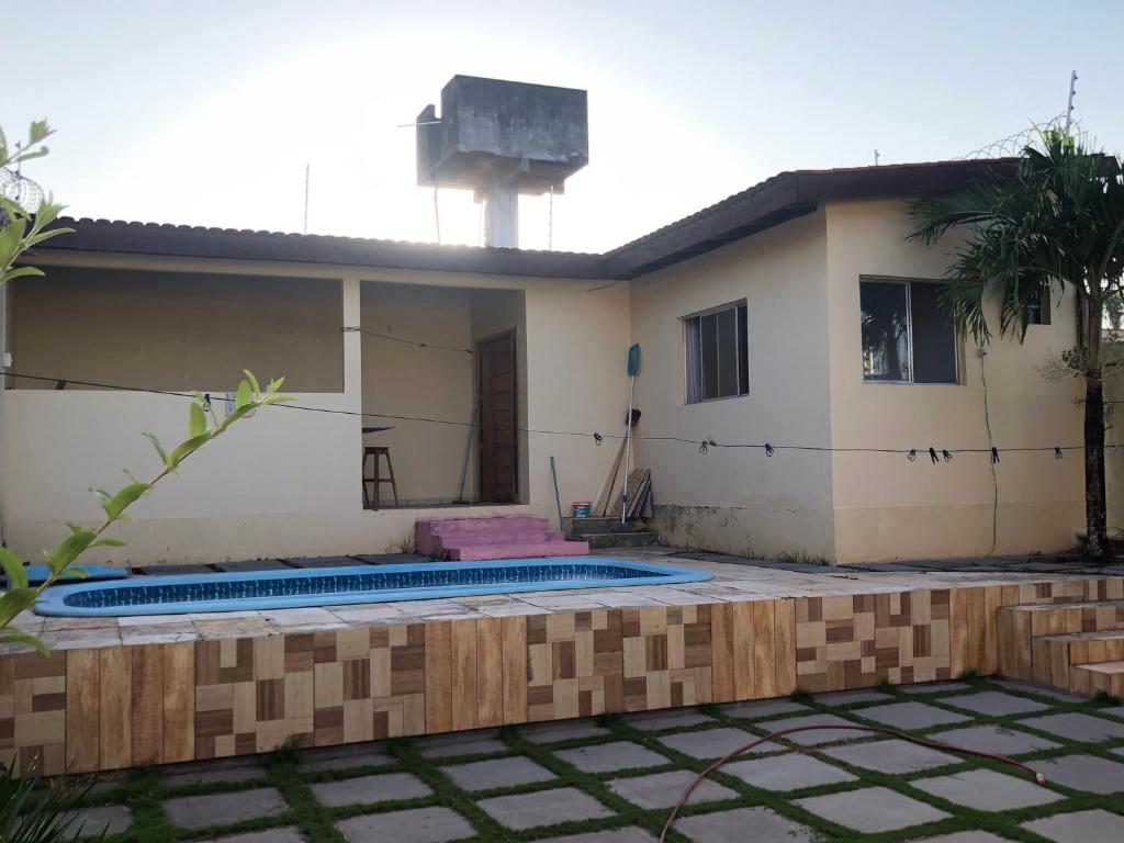 a house under construction with a swimming pool at Kitnet- Edícula em Fazendinha in Macapá