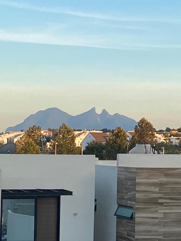 a view of mountains from the roof of a building at SweetHome in Monterrey