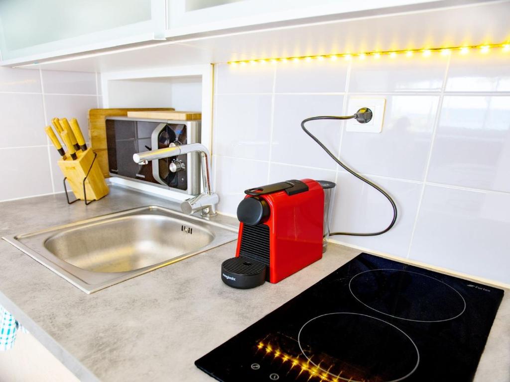 Kuchyň nebo kuchyňský kout v ubytování Studio Casa Sun