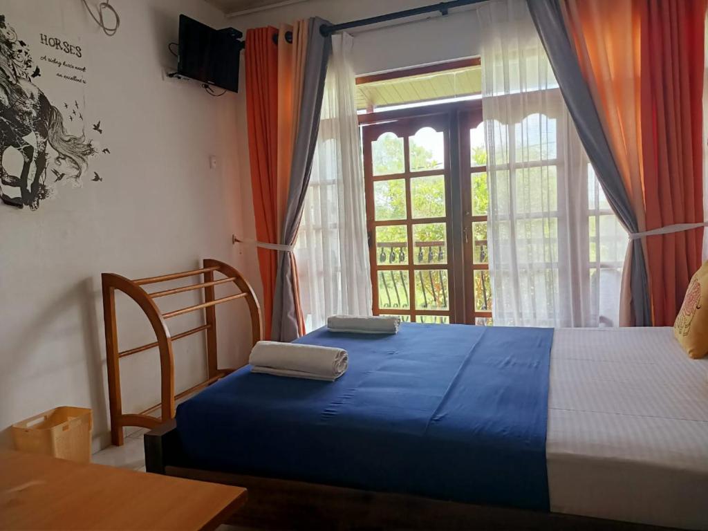 Postel nebo postele na pokoji v ubytování Andorra Tourist Resort Anuradhapura