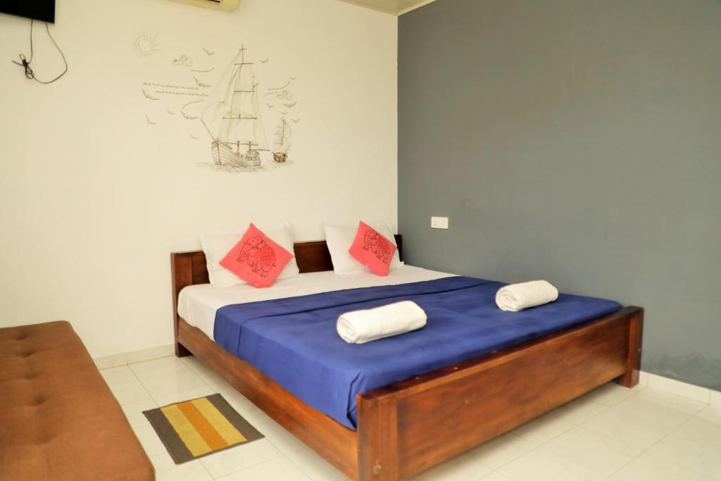 Postel nebo postele na pokoji v ubytování Andorra Tourist Resort Anuradhapura