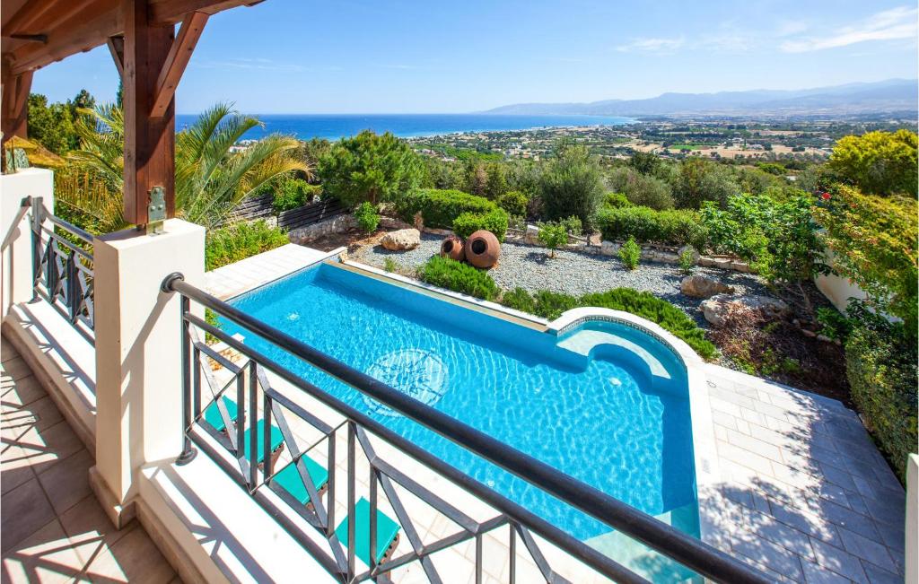 a pool on the balcony of a villa at Nice Home In Neo Chorio With 2 Bedrooms, Outdoor Swimming Pool And Swimming Pool in Neo Chorio