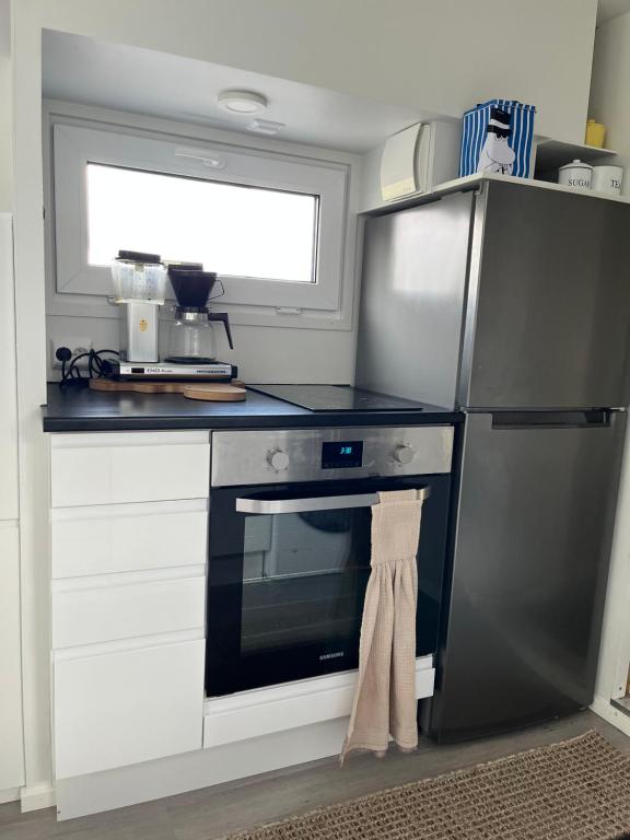 Kuchyň nebo kuchyňský kout v ubytování Luxus Tiny House Saagala