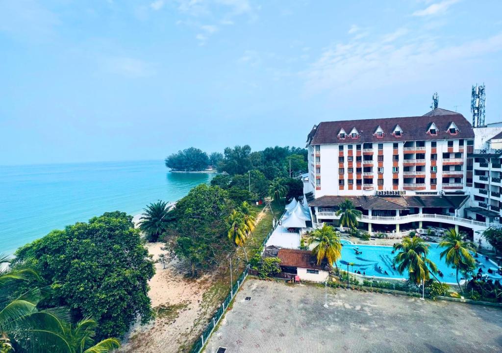 an aerial view of a hotel and the ocean at Penthouse Seafront View PD in Port Dickson